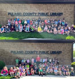 EPES 2nd Grade & Kindergarten classes standing in front of PCPL building