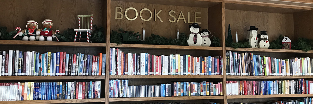 The library's Book Sale shelves displaying books for sale.