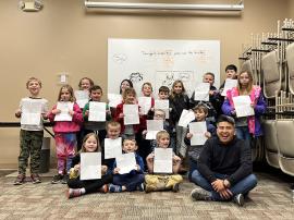 Participants showing off their creations at Comics with Jingo