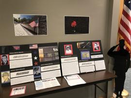 Vietnam Veterans Memorial posters and photos on display at the library