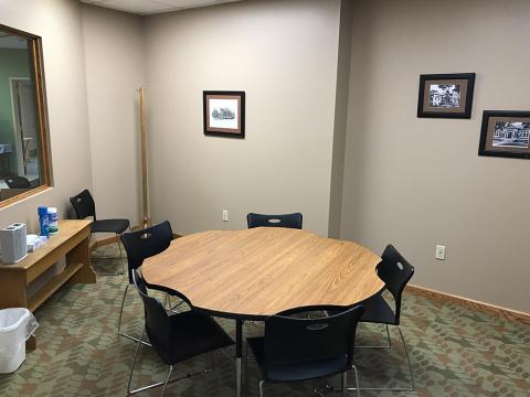 Tutor Room A, showing a round table and six chairs.