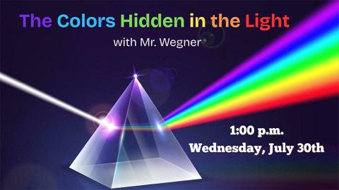 a triangular prism showing white light being refracted into a rainbow of colors