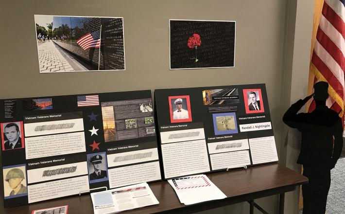 Vietnam Veterans Memorial posters and photos on display at the library